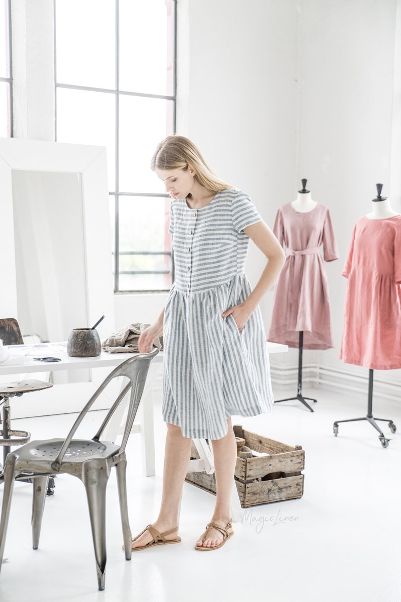 Come discover these Over 50 Fashion: Running Errands Comfy Cute Pieces! Blue and white striped linen dress with pockets is so comfortable and perfect for layering. #fashionover50