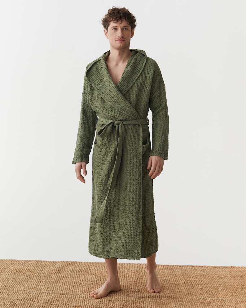May include: A green waffle weave robe with a hood and a self-tie belt.