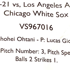 May include: A baseball game scorecard with the text "14-Sep-21 vs, Los Angeles Angels at Chicago White Sox VS967016 Top 4 - H: Shohei Ohtani - P: Lucas Giolito - 3 - Ball - Ball - Slider - Pitch Number: 3, Pitch Speed: 86.5 MPH, Balls 2 Strikes 1."
