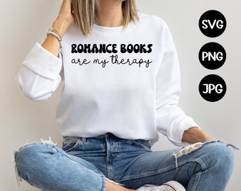 May include: A white sweatshirt with the text "Romance Books are my therapy" in black lettering. The text is in a retro font style.