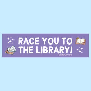 May include: Purple sticker with white text that reads "Race you to the library!" with a small book illustration and sparkles on either side. The text "@radicalbuttons" is in smaller white text at the bottom.