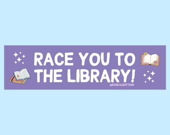 May include: Purple sticker with white text that reads "Race you to the library!" with a small book illustration and sparkles on either side. The text "@radicalbuttons" is in smaller white text at the bottom.