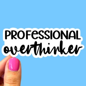 May include: White sticker with black text that reads "PROFESSIONAL overthinker".