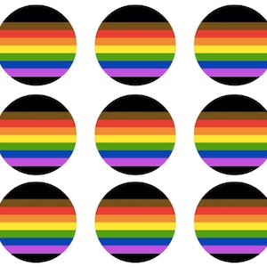 May include: Nine round stickers with a rainbow pride flag design. The flag has brown, orange, yellow, green, blue, and purple stripes.