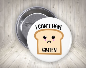 May include: White button with a cartoon slice of bread with a sad face and the text "I can't have gluten".