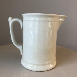 American Ironstone Water Milk Pitcher Marked with English Coat of Arms