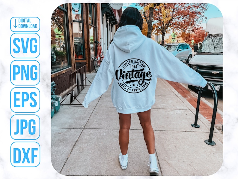 May include: White hooded sweatshirt with black text that reads "Limited Edition - 1974 - Vintage Aged to Perfection".