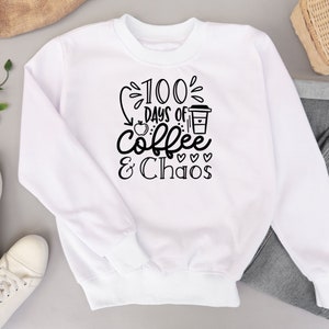 May include: White sweatshirt with black text that reads "100 Days of Coffee & Chaos" with a coffee cup and apple graphic.