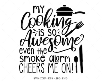 May include: Black and white graphic design with the text "My cooking is so awesome even the smoke alarm cheers me on!"  The design includes a frying pan, fork, knife, and spoon.