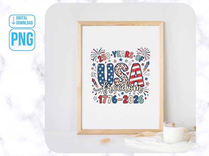 May include: A framed print with the text "250 YEARS OF USA freedom 1776-2026" in red, white, and blue. The word "USA" is in a patriotic design with stars and stripes. Fireworks and stars surround the text. A candle sits in front of the frame.