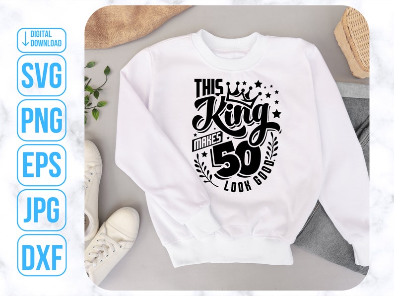 May include: White sweatshirt with black text that reads "This King Makes 50 Look Good" with a crown and stars.
