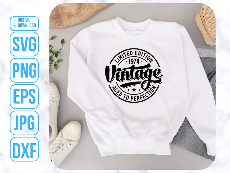 May include: White sweatshirt with a black circle graphic that says "Limited Edition - 1974 - Vintage Aged to Perfection".