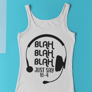 May include: White tank top with a black graphic of a headset and the text "Blah Blah Blah Just Say 10-4".