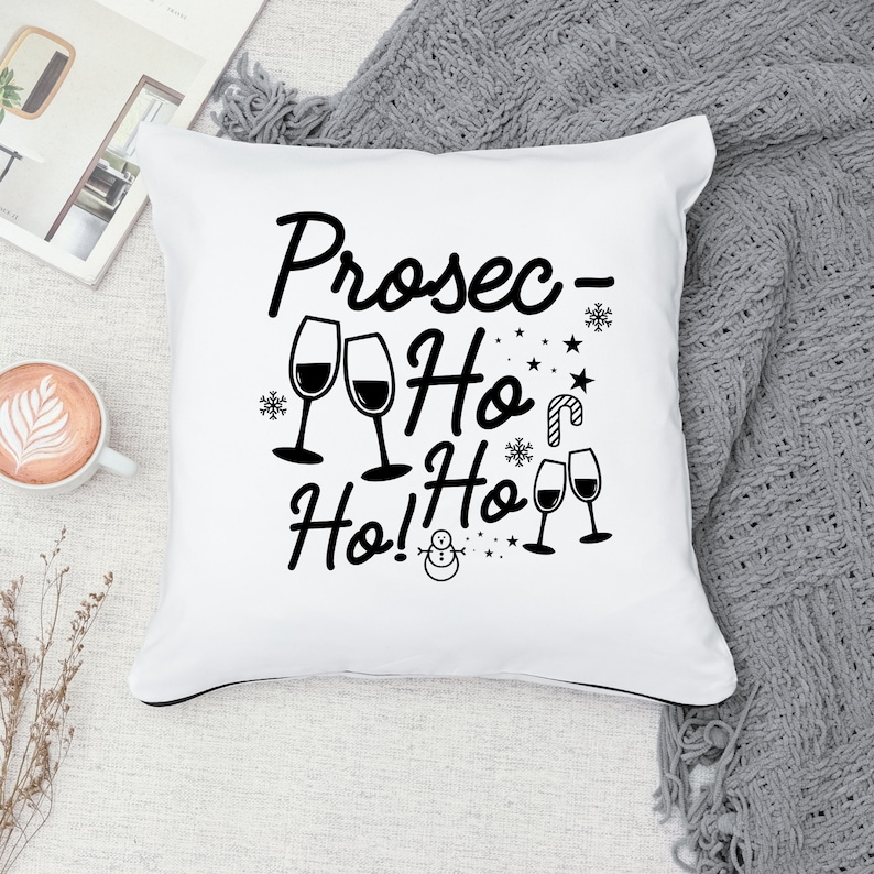 May include: White throw pillow with black text that reads "Prosec-Ho Ho! Ho!" with a snowman and wine glasses.