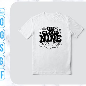 May include: White t-shirt with black text that reads "On Cloud Nine" with a cloud and smiley face graphic.