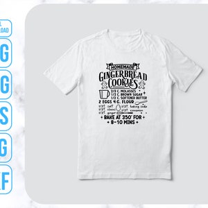 May include: A white t-shirt with a black graphic design that reads "Homemade Gingerbread Cookies" and includes a recipe for gingerbread cookies. The recipe includes ingredients such as molasses, brown sugar, softened butter, eggs, flour, salt, baking soda, cloves, ginger, and cinnamon. The recipe also includes instructions to bake at 350 degrees Fahrenheit for 8-10 minutes.