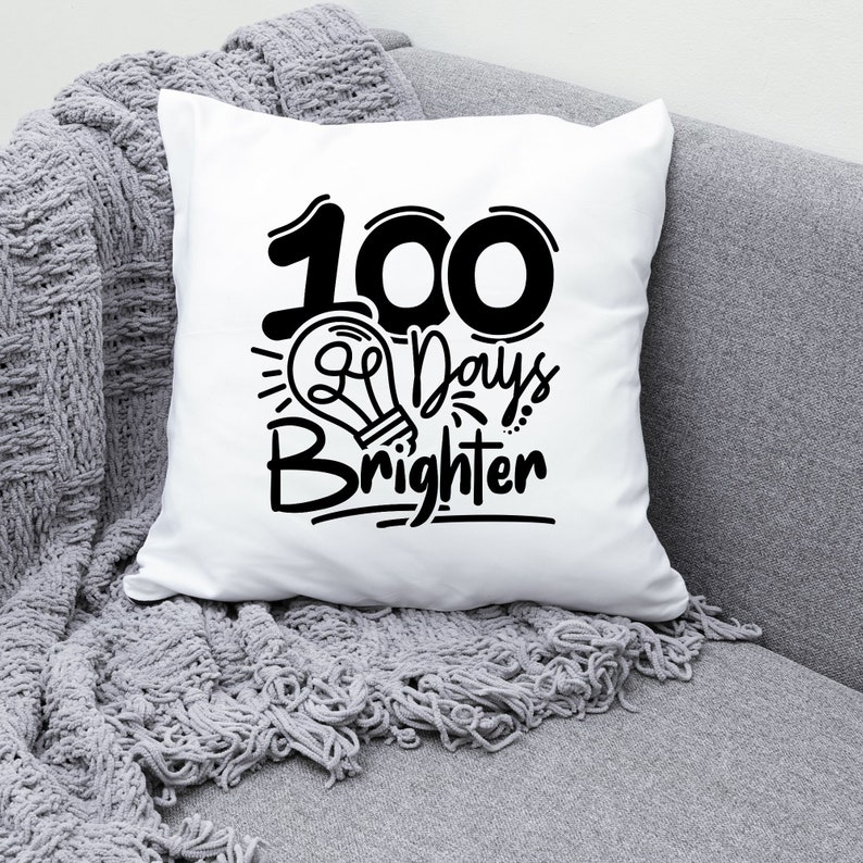 May include: White throw pillow with black text that reads "100 Days Brighter" with a lightbulb graphic.