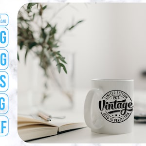 May include: White ceramic mug with a black circle design that says "Limited Edition - 1974 - Vintage Aged to Perfection".