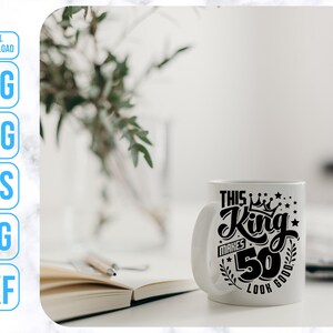 May include: White ceramic mug with a black design that says "This King Makes 50 Look Good".