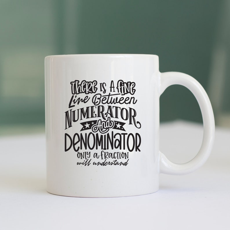 May include: White ceramic mug with a black text design. The text reads: "THERE IS A FINE LINE BETWEEN NUMERATOR AND DENOMINATOR. ONLY A FRACTION will understand."