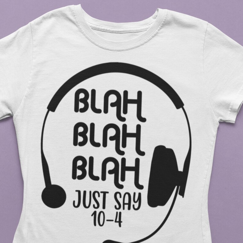 May include: White t-shirt with a black graphic of a headset and the text "Blah Blah Blah Just Say 10-4".