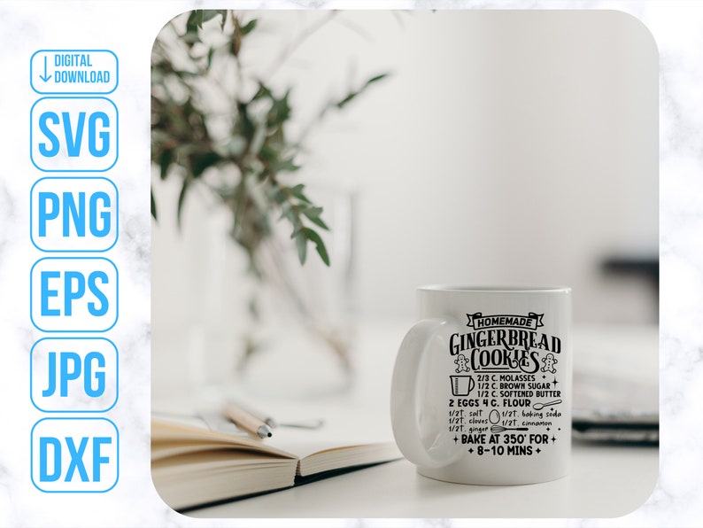 May include: White ceramic mug with a black design that reads "Homemade Gingerbread Cookies" and includes a recipe for gingerbread cookies. The mug is sitting on a white marble surface.