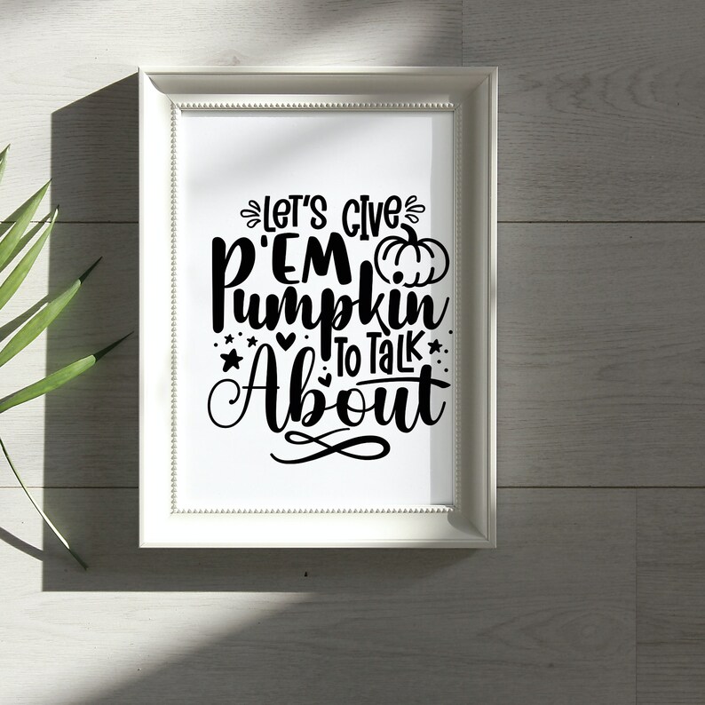 May include: White framed print with black text that reads "Let's give 'em pumpkin to talk about" with a small pumpkin graphic.