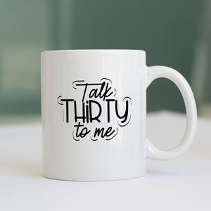 May include: White ceramic mug with black text that reads "Talk Thirty to Me".