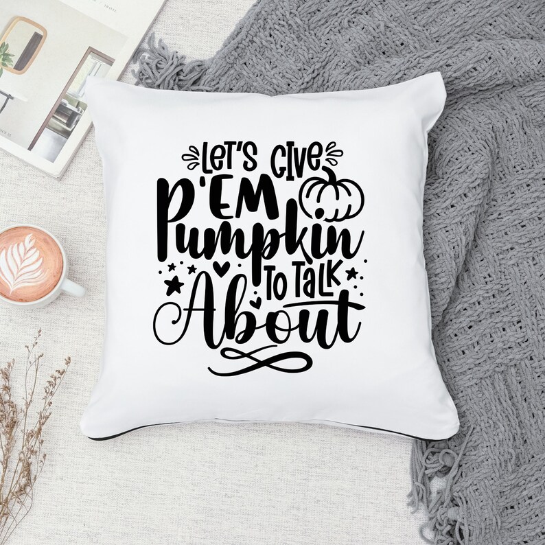 May include: White throw pillow with black text that reads "Let's give 'em pumpkin to talk about" with a small black pumpkin graphic.