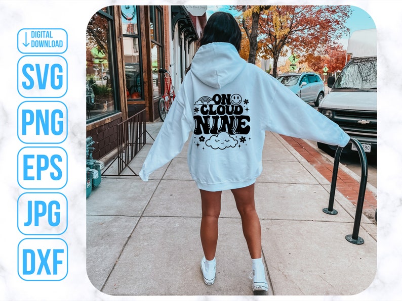 May include: A white hoodie with black text that reads "On Cloud Nine" with a smiley face and a cloud graphic.