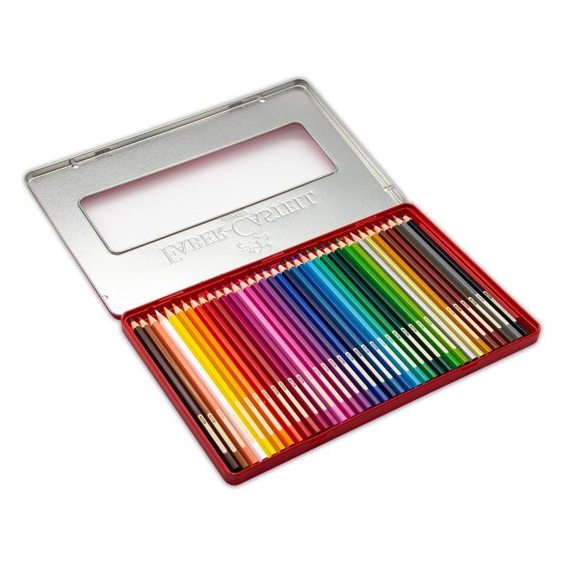 May include: A red metal tin with a clear window, containing a set of 36 coloured pencils. The pencils are arranged in rows, with the tips facing up. The tin is labelled "Faber-Castell" in white lettering.