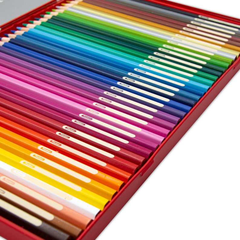 May include: A set of coloured pencils in a red tin box. The pencils are arranged in a rainbow pattern, with the red pencils at the top and the blue pencils at the bottom. The pencils are all sharpened and ready to use.