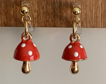 Orange Mushroom Earrings for Children, Tiny lightweight metal orange and gold charms invisible clip on for kids.