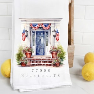May include: A white kitchen towel featuring a watercolour illustration of a blue front door with red, white and blue bunting and potted plants. The address 77008 Houston, TX is printed below the illustration.