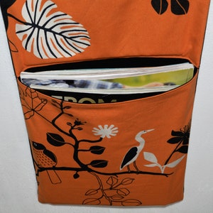 Wall utensil for magazines Mrs Knallerbse The orange wall organizer with birds and branches creates storage space in the office image 4