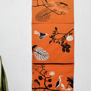 Wall utensil for magazines Mrs Knallerbse The orange wall organizer with birds and branches creates storage space in the office image 2