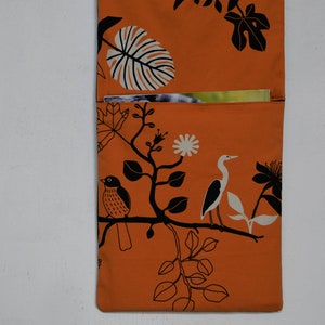 Wall utensil for magazines Mrs Knallerbse The orange wall organizer with birds and branches creates storage space in the office image 5