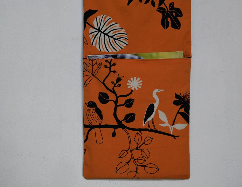 Wall utensil for magazines Mrs Knallerbse The orange wall organizer with birds and branches creates storage space in the office image 5