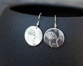 round embossed silver earrings