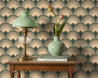 May include: A wooden table displays a mint green lamp, a vase with flowers, and a book titled "WILDFLOWERS." The background features a repeating fan-shaped pattern in beige and dark green, creating a vintage aesthetic.