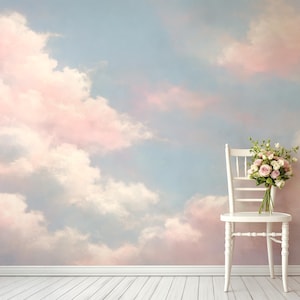 May include: A white wooden chair with a bouquet of pink and white flowers sits against a wall mural depicting a pastel sky with pink and white clouds. The floor is made of white wooden planks.