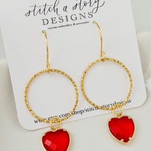 crystal heart earrings on round hoops, gold hoop heart earrings, red heart earrings, pink heart earrings, clear heart earrings, black hearts
