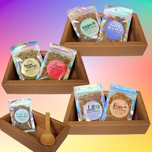 Tea sampler box showing seven all-natural Urbll tea blends in labeled packets, perfect variety pack for tea lovers and holiday gifts.