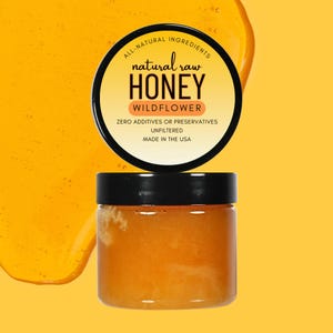 May include: A jar of natural raw wildflower honey with a black lid. The label reads "All-Natural Ingredients, natural raw HONEY, WILDFLOWER, ZERO ADDITIVES OR PRESERVATIVES, UNFILTERED, MADE IN THE USA". The background is a bright yellow.