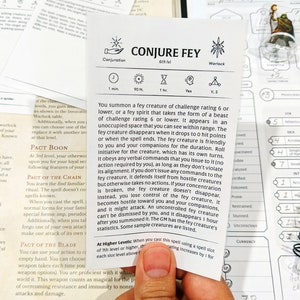 May include: A black and white card with the title "Conjure Fey" and a description of the spell. The card is part of a Dungeons and Dragons game.