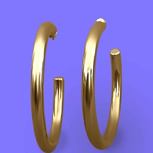 May include: A pair of gold hoop earrings. The earrings are thick and have a smooth, polished finish.