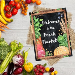 May include: A chalkboard sign with a rustic wooden frame and a burlap background. The sign says "Welcome to the Fresh Market" with watercolor illustrations of vegetables and wheat.