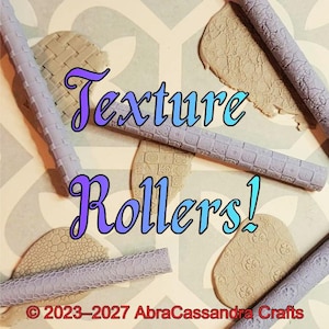 May include: Four light purple cylindrical texture rollers with various embossed patterns, placed over tan clay pieces with matching impressions. The image features the text Texture Rollers! and 2023-2027 AbraCassandra Crafts.