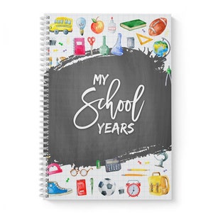 May include: A spiral bound notebook with a black chalkboard background and the text "My School Years". The cover is decorated with colourful watercolour illustrations of school supplies, including a bus, a globe, a calculator, a pencil, a ruler, a book, a pair of glasses, a football, a clock, and a backpack.
