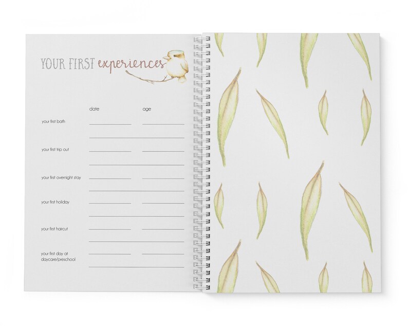 May include: A white journal with a spiral binding and a watercolor illustration of a bird on a branch. The cover has the text "YOUR FIRST experiences" and the inside pages have headings for "date" and "age" with lines for writing.